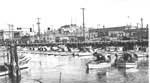 The basin at Taylor Street. Note the men steering their montereys into port. May 18, 1936. A12,28,689n