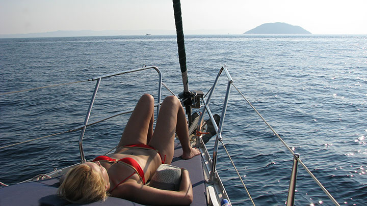 Halkidiki sailing - relaxing on deck near kelyfos island